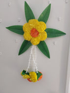 Artificial marigold, mango leaves & Lilly flowers wall hanging