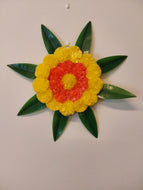 Artificial marigold and mango leaves wall hanging