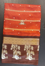 Load image into Gallery viewer, Rust orange Dola silk saree with hand printed
